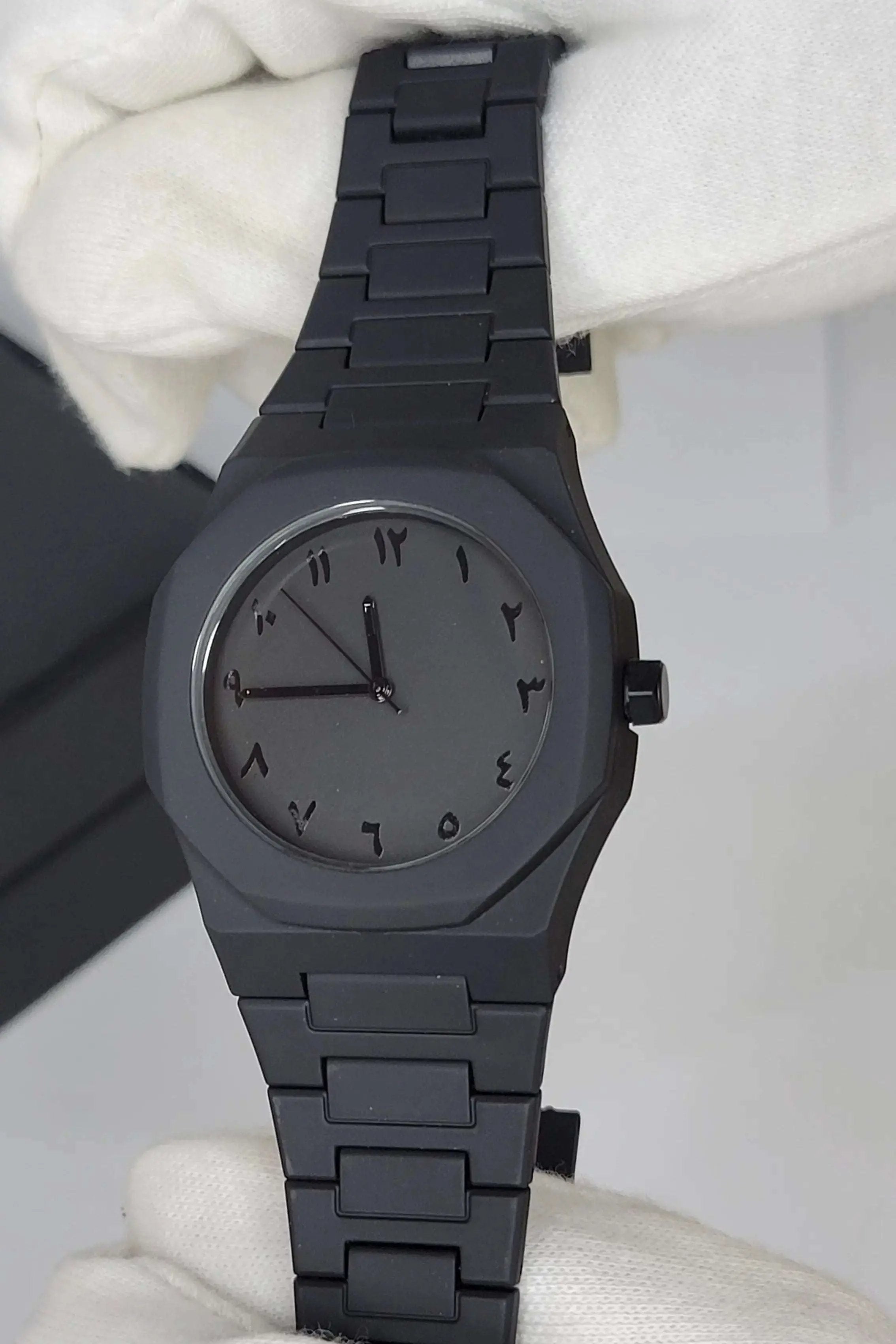 Side profile of Arabic Aura Black Watch showing carbon fiber strap and water-resistant case