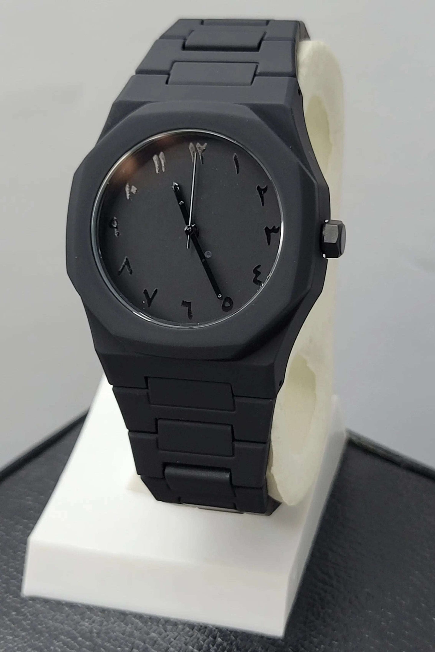 Arabic Aura Black Watch featuring matte black dial, carbon fiber case