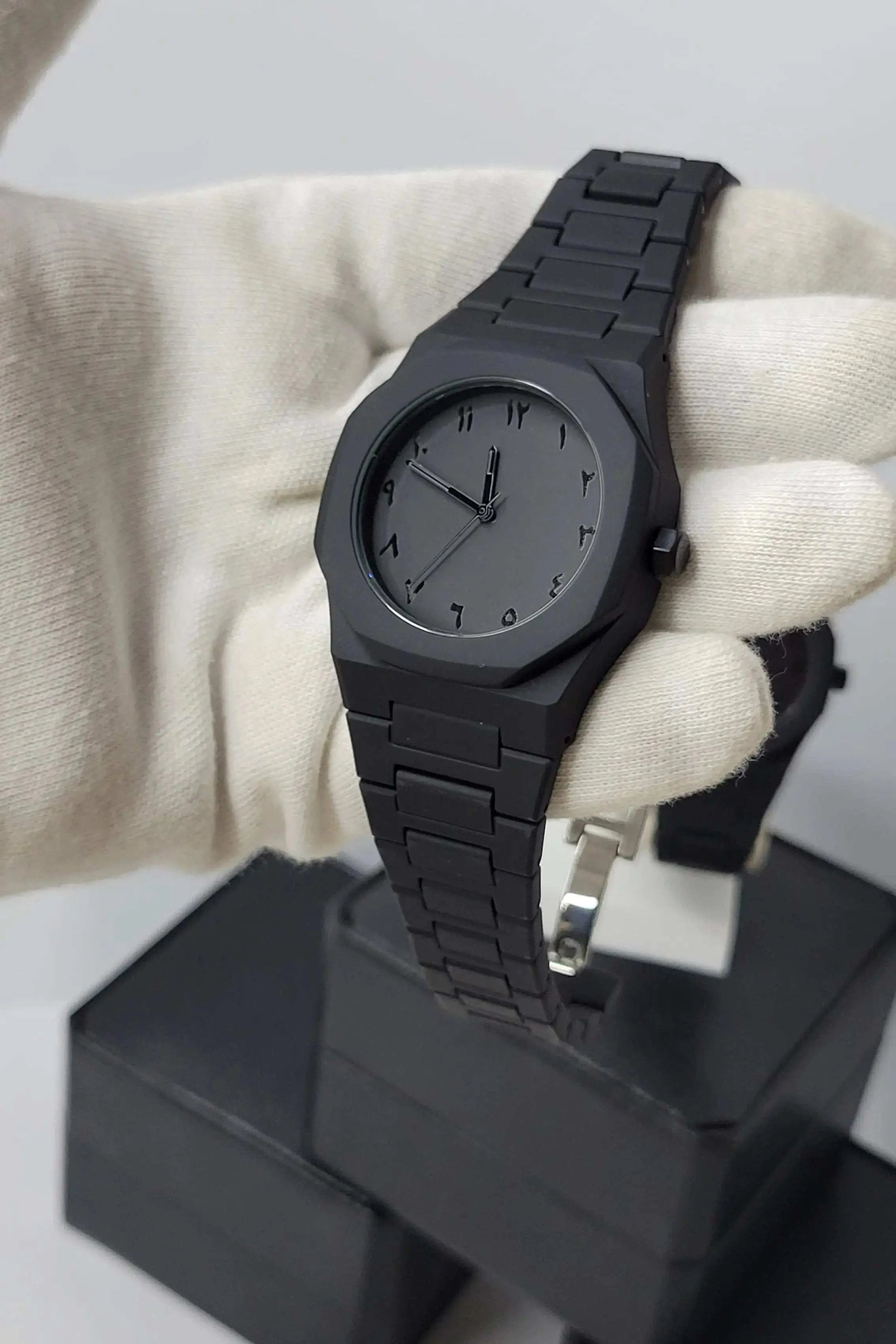 Side profile of Arabic Aura Black Watch showing carbon fiber strap and water-resistant case