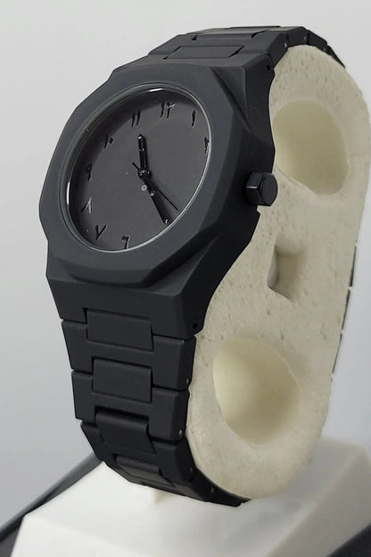 Side profile of Arabic Aura Black Watch showing carbon fiber strap and water-resistant case.