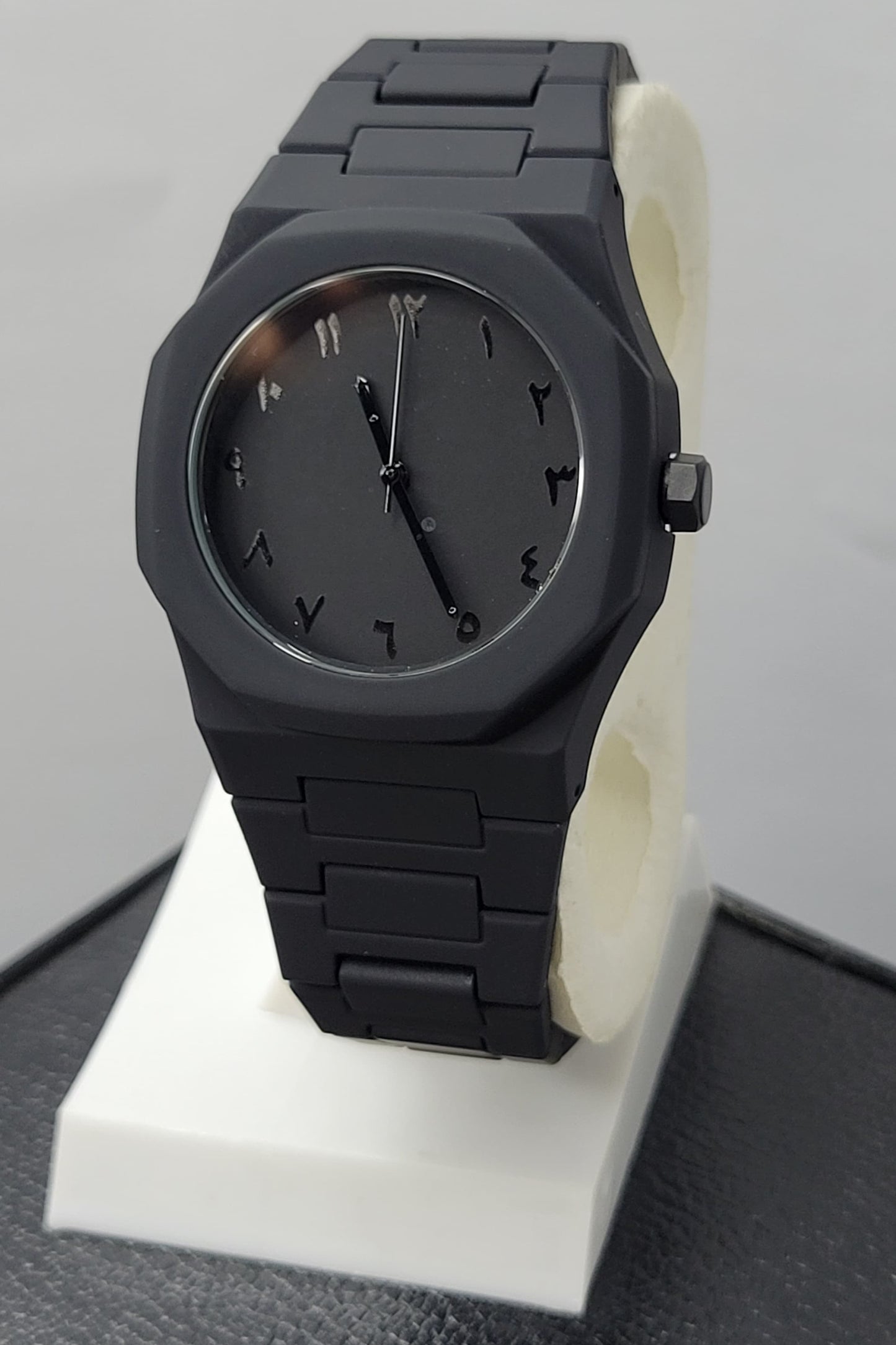 Arabic Aura Black Watch featuring matte black dial, carbon fiber case