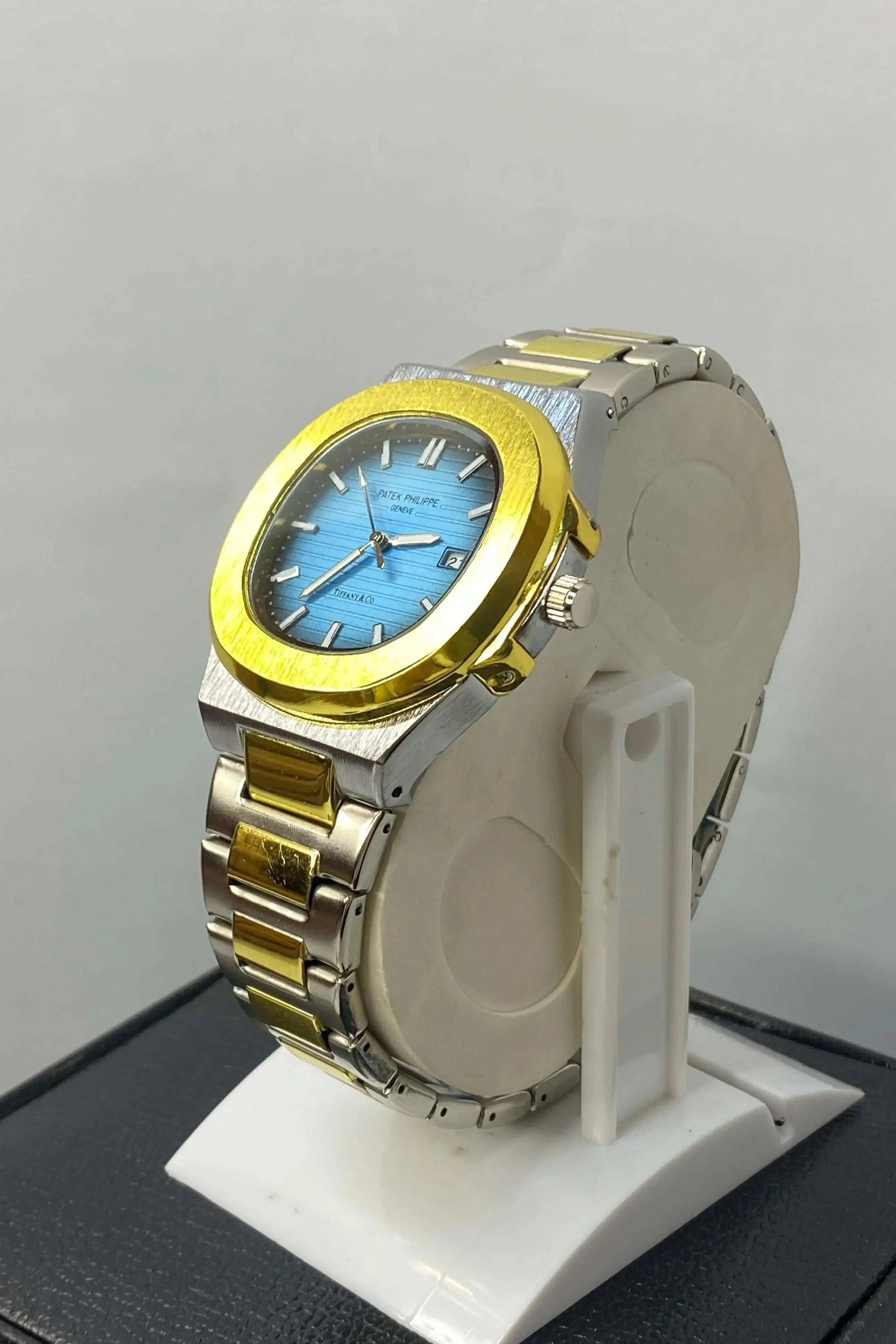 Side profile of Patek Philippe Geneve Thanaco Watch with stainless steel strap and sleek crown detailing.