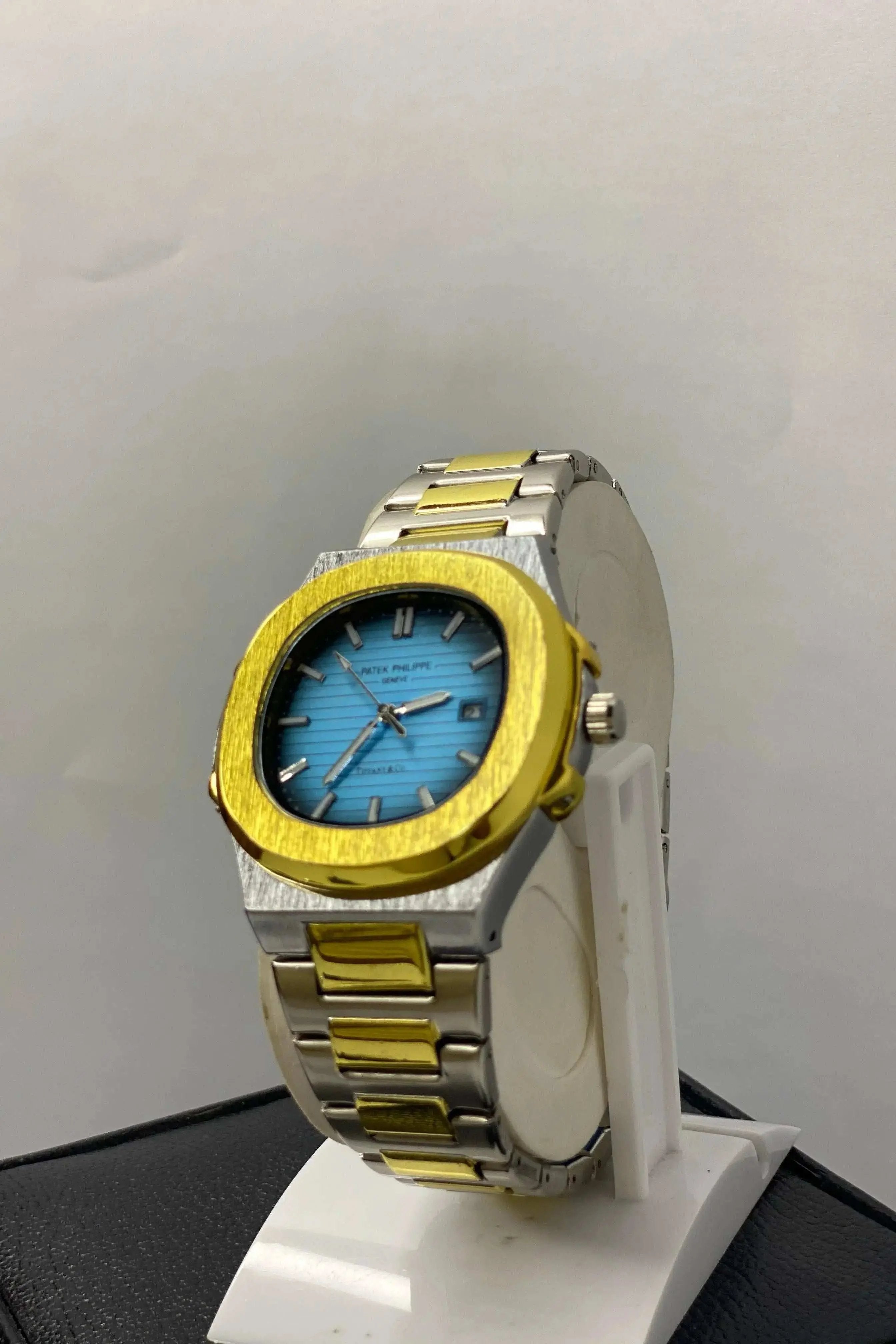 Side profile of Patek Philippe Geneve Thanaco Watch with stainless steel strap and sleek crown detailing