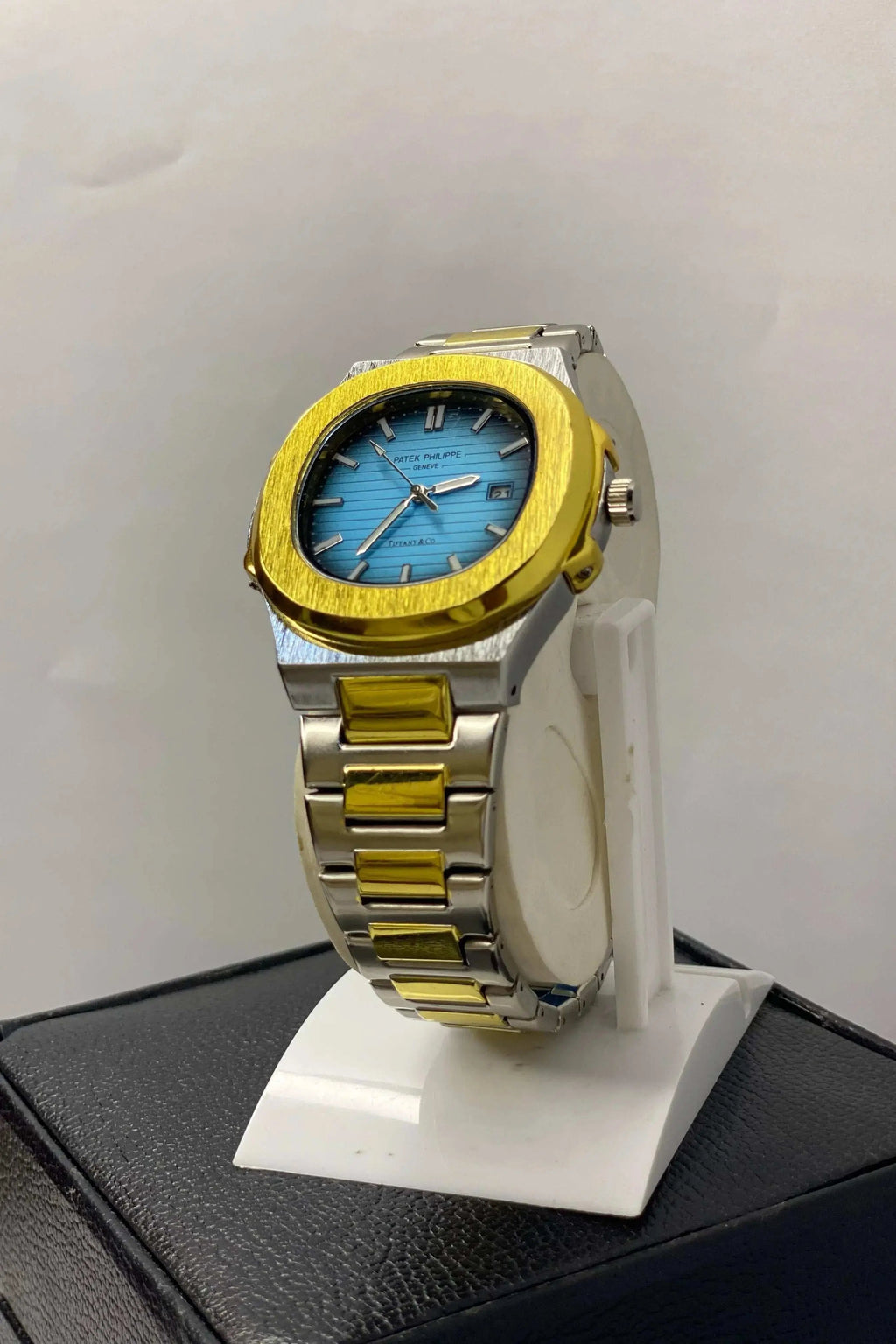 Side profile of Patek Philippe Geneve Thanaco Watch with stainless steel strap and sleek crown detailing