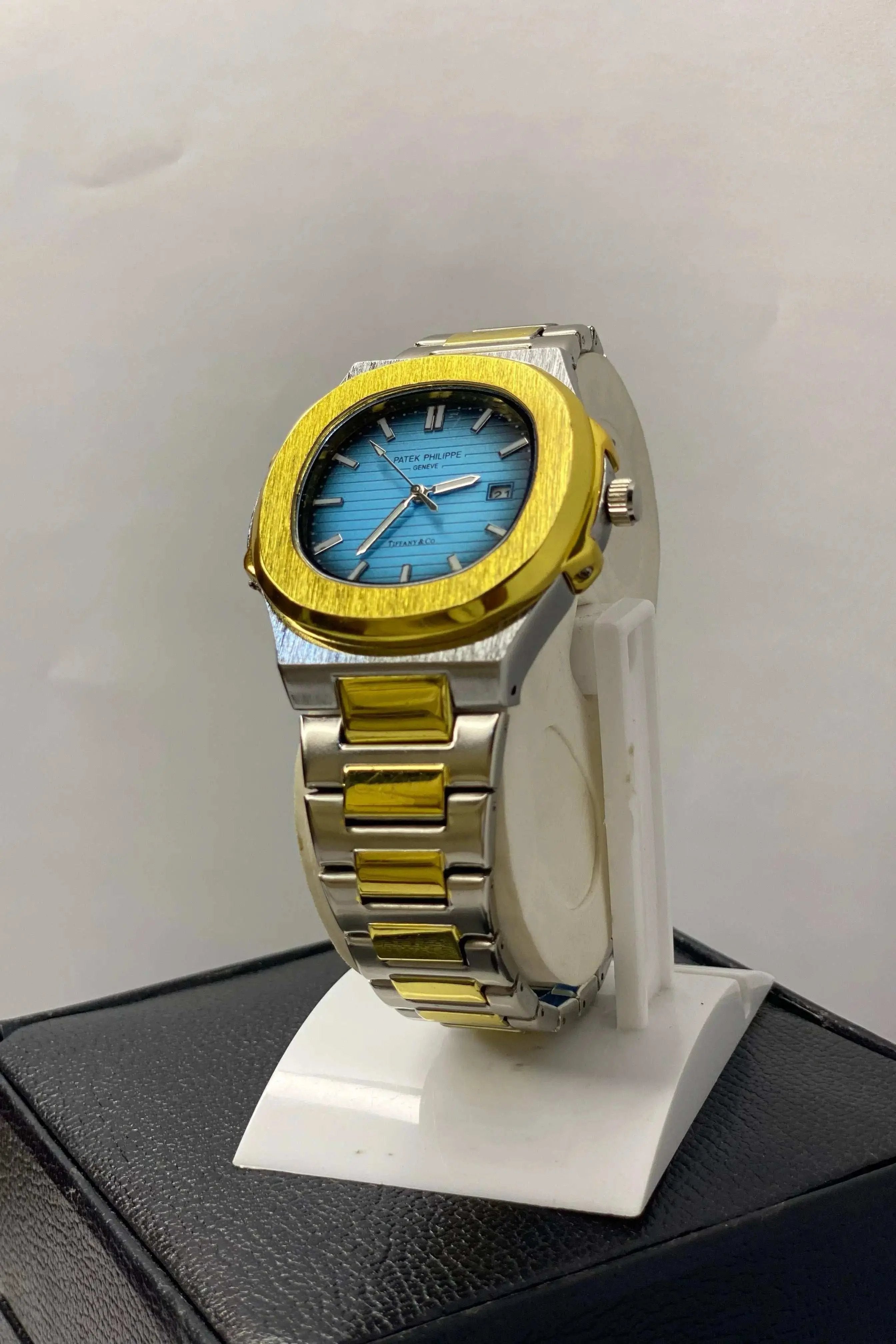 Side profile of Patek Philippe Geneve Thanaco Watch with stainless steel strap and sleek crown detailing